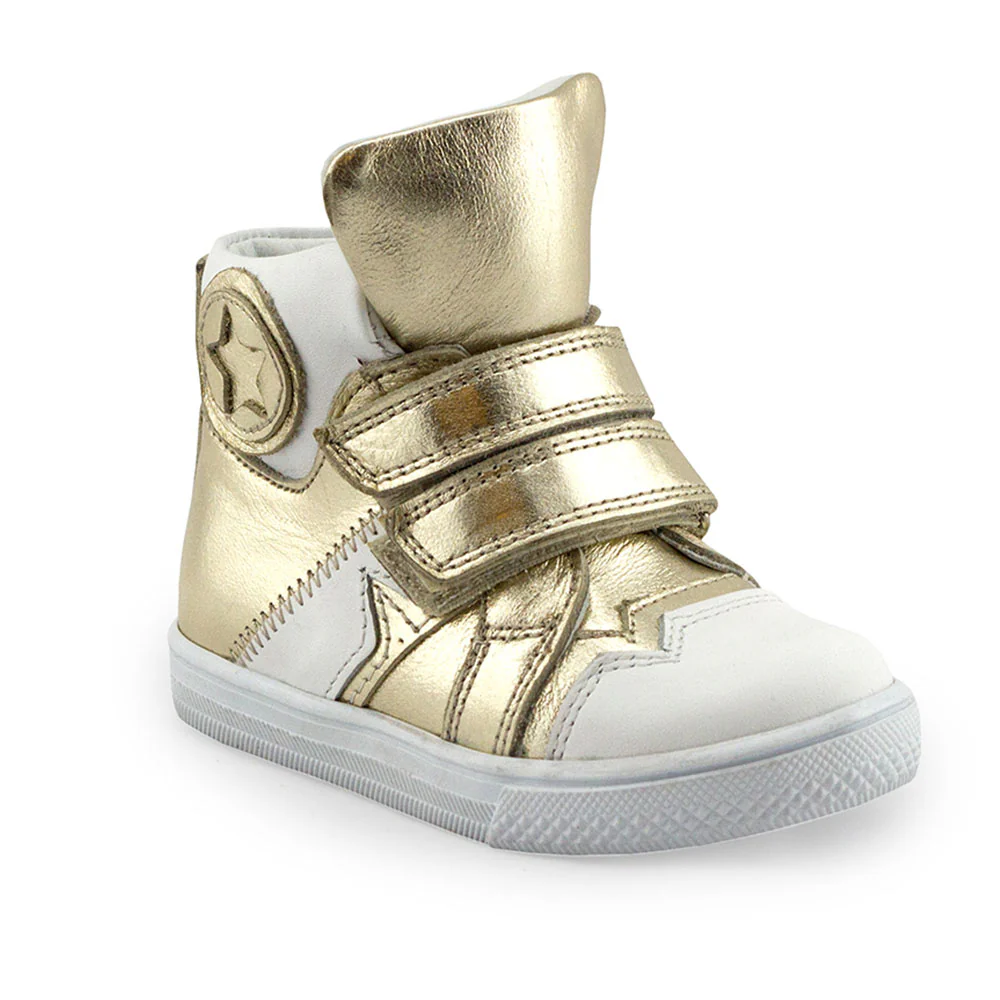 a gold and white high top sneaker on a white background