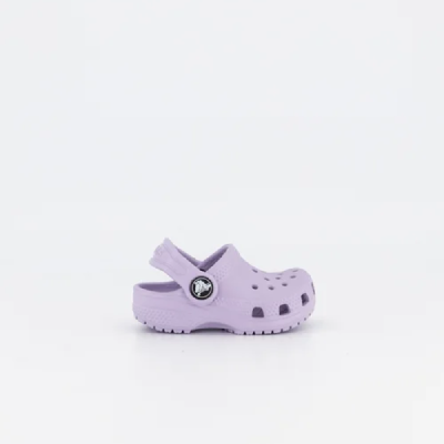 A little girl's purple clogs on a white background.