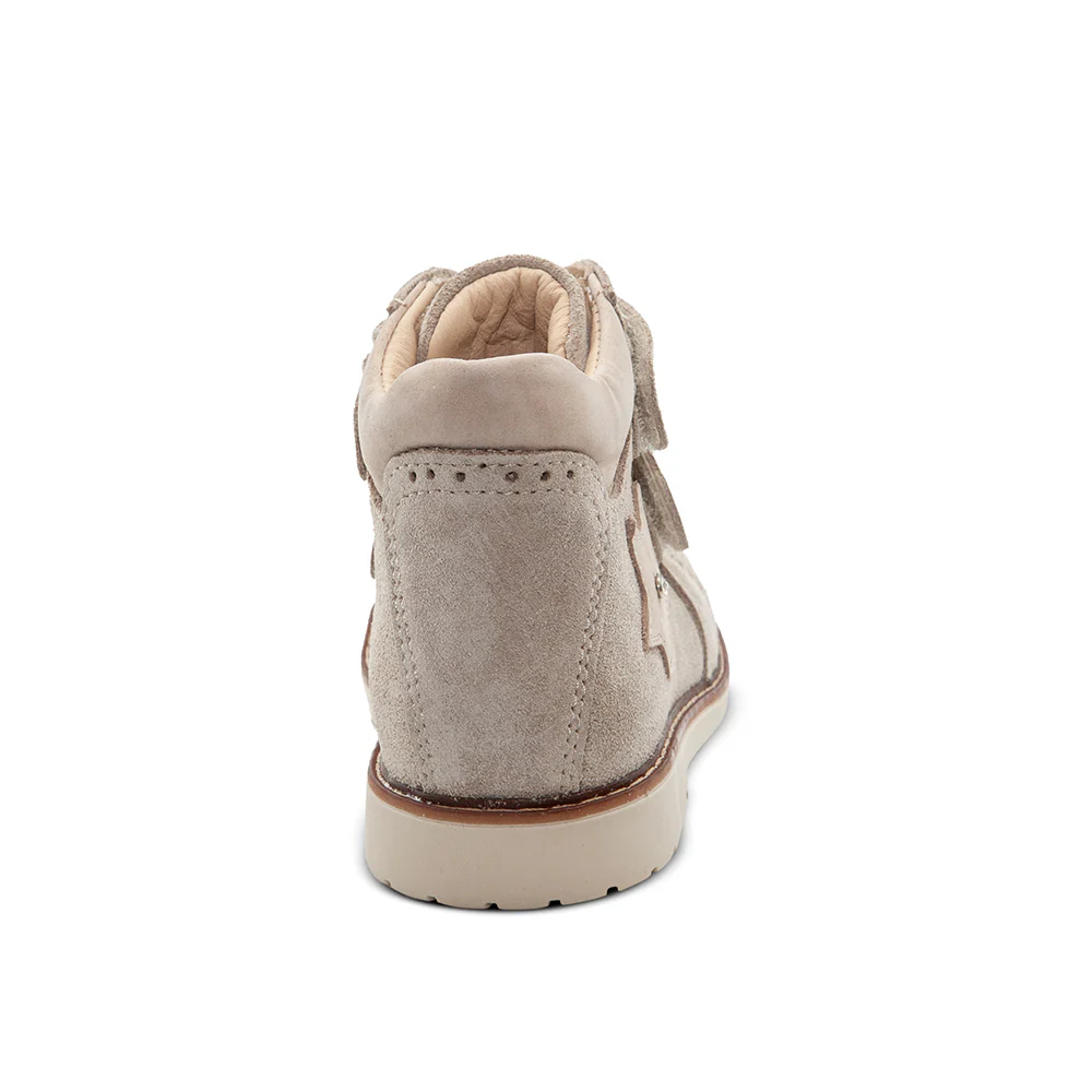 a child's shoe on a white background