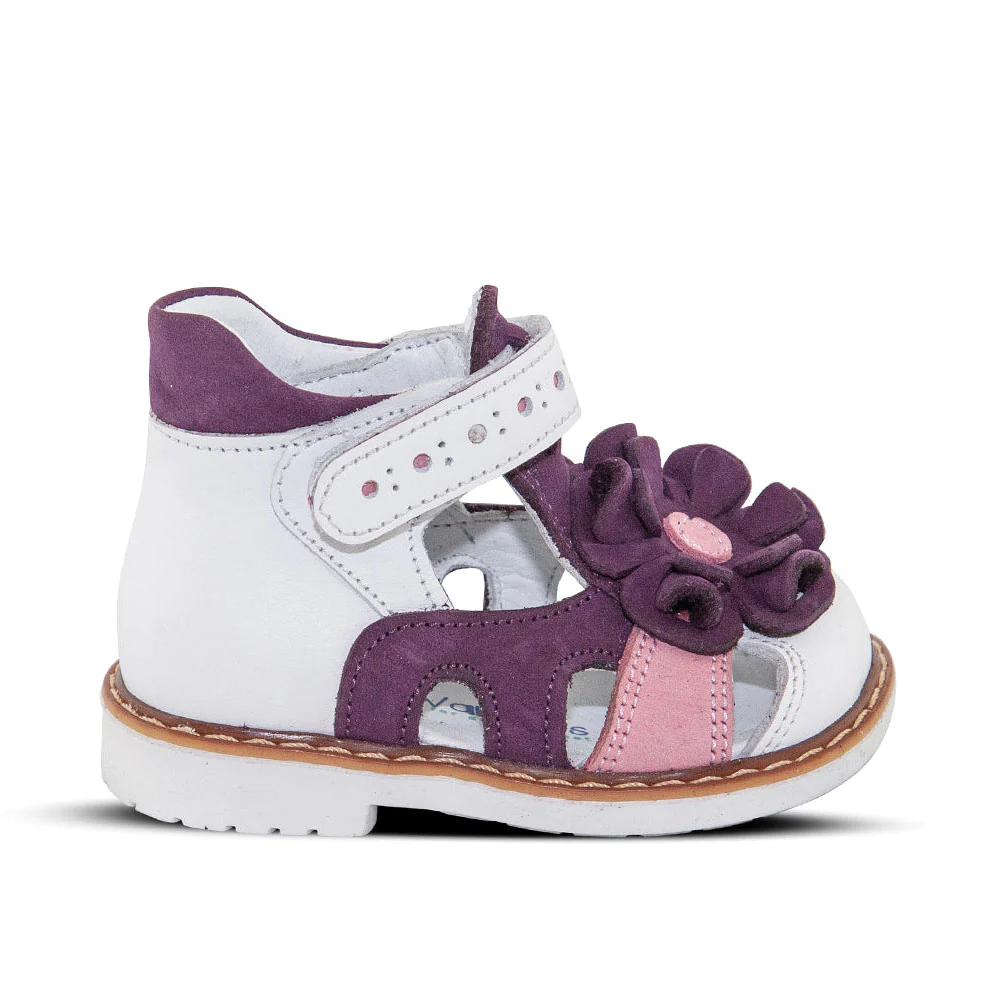A white and purple kids'  sandal with a flower on the side