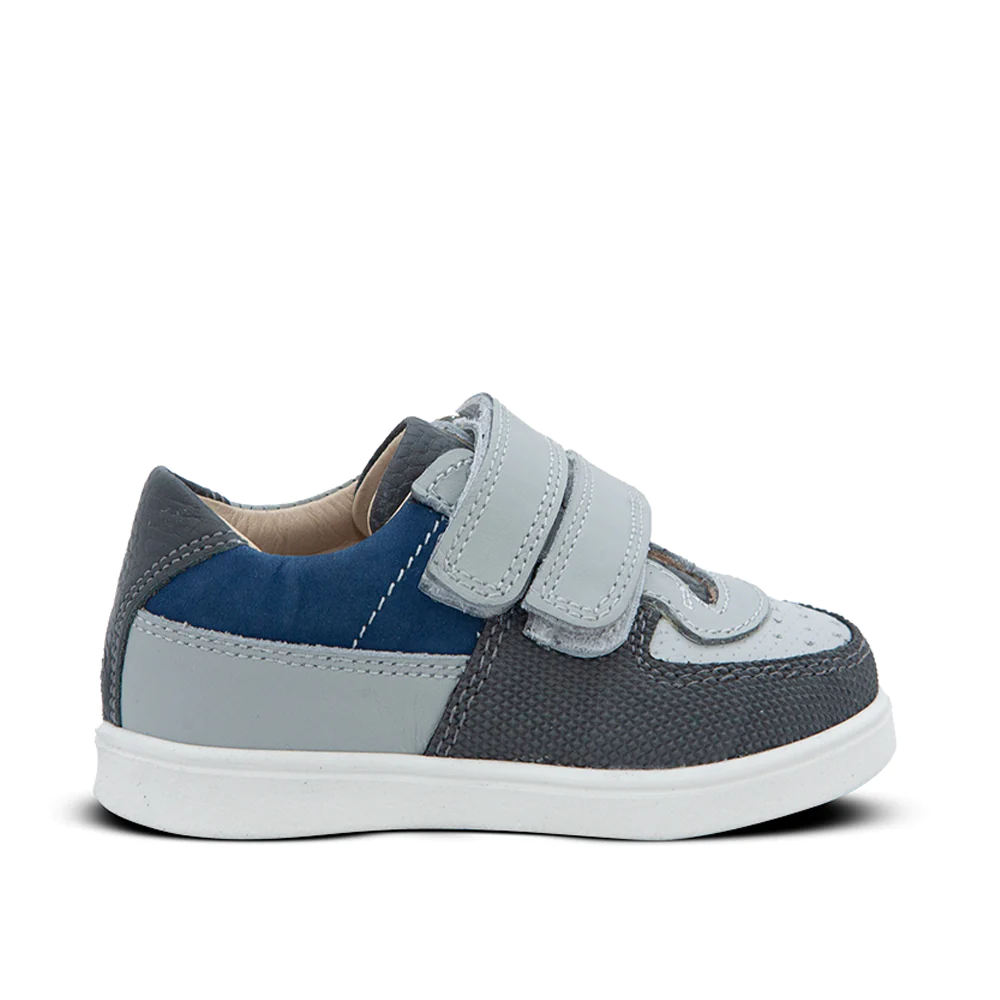 A gray and blue sneaker with two straps