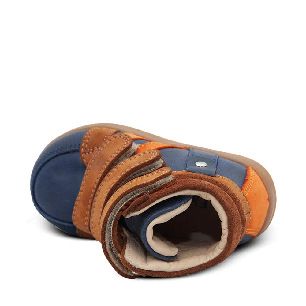 A top-down view of a child's blue and orange shoe