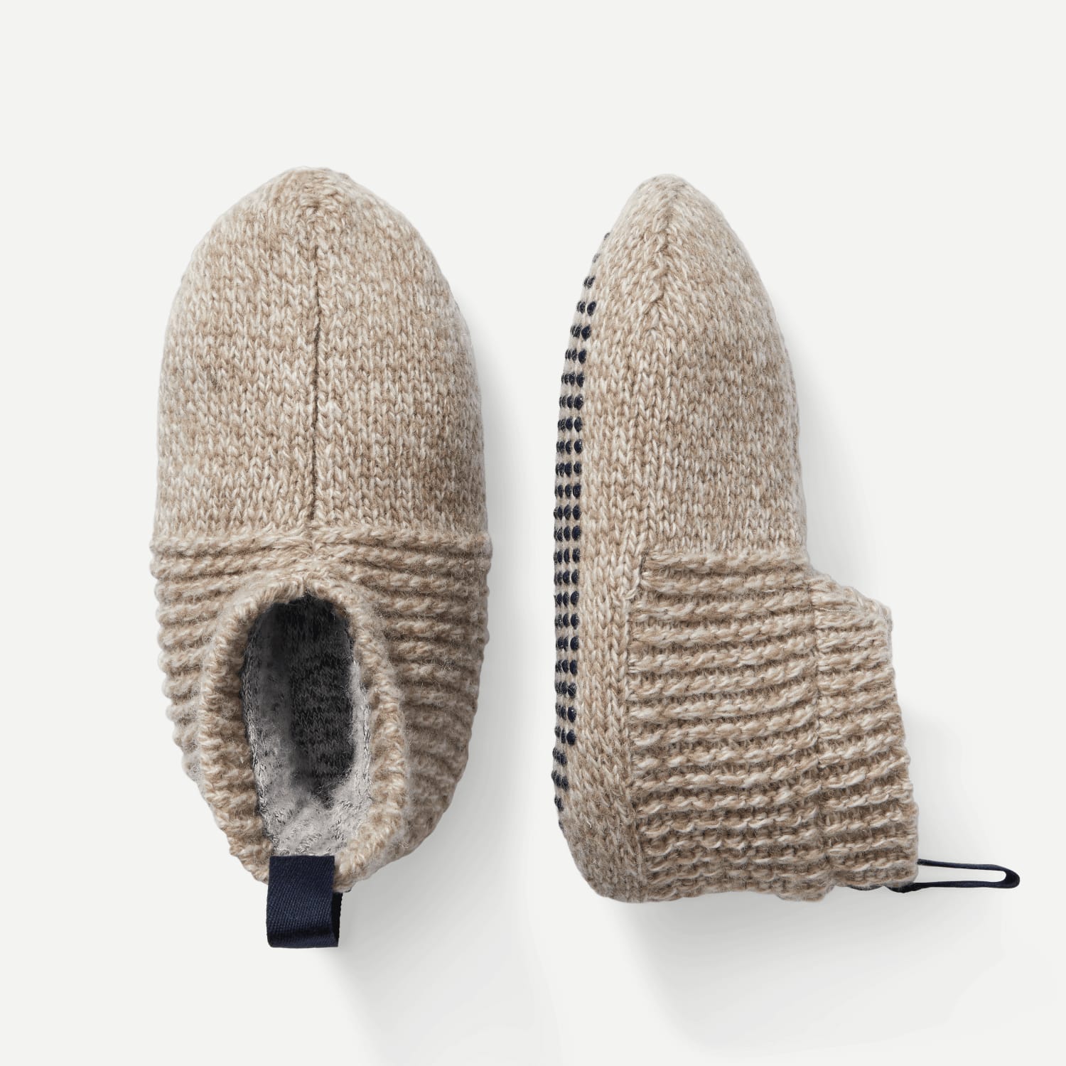A pair of knitted slippers on a white background.