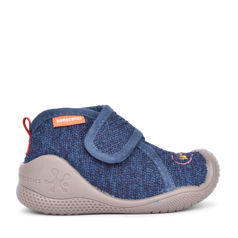 A child's blue shoe with a red shoelace.