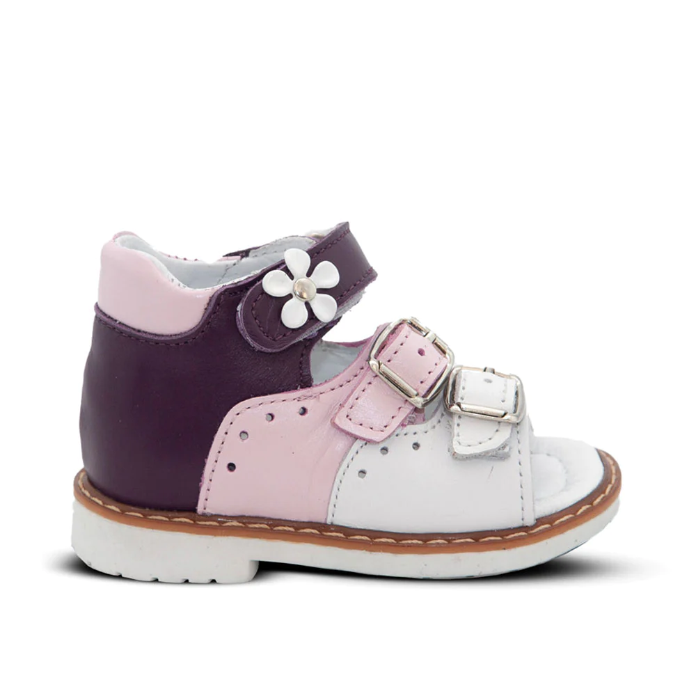 A white and purple kids' sandal with a flower on the side