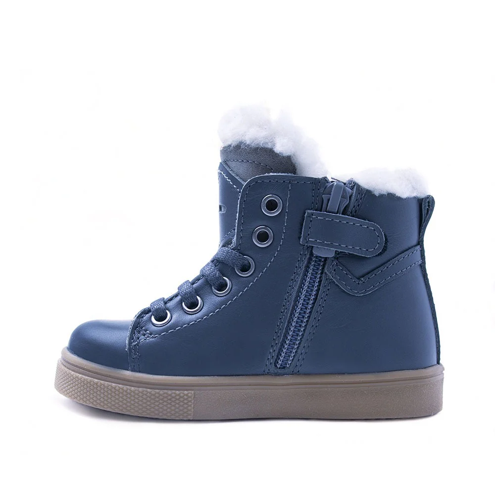 a child's blue boot with a fur lined top