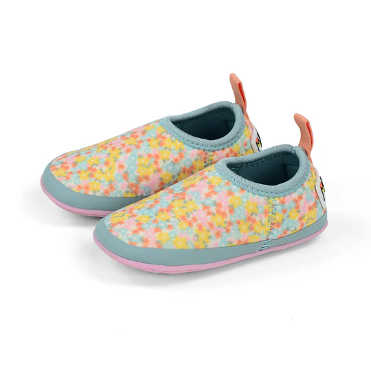 A pair of children's reef booties with colorful flowers on them.