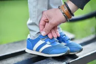 A closeup of kid's velcro shoes.