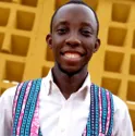 a man in a white shirt and blue and pink suspenders