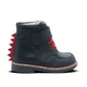 A child's boot with red spikes on the back