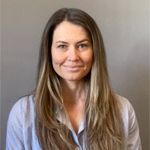a woman with long hair is smiling for the camera