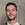 a man with a mustache and a vest