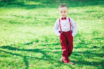 A dapper little gent wearing formal toddler boy shoes.