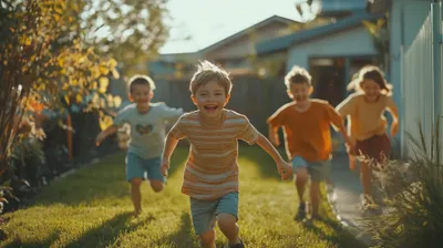 a group of children running in a yard