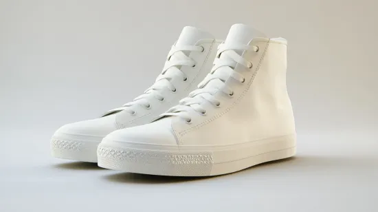 a pair of white sneakers on a white background