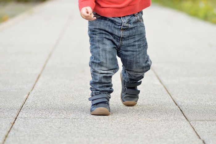 A little boy walking—monitor walking behaviour such as stomping in kids.