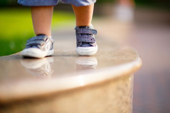 A close up of a child wearing Velcro shoes which is a good option for kids with sensory issues.