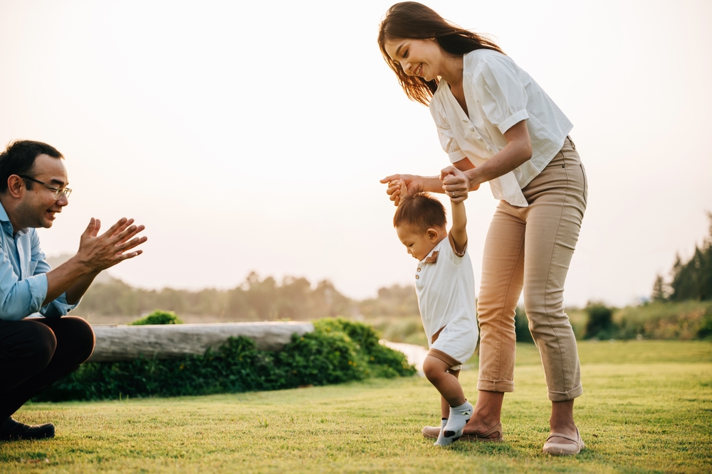 Parents helping their son with pigeon toes using exercises.