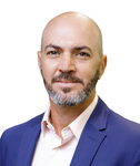 a man in a blue suit and white shirt