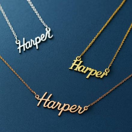 three personalized Harper name necklaces on a blue surface