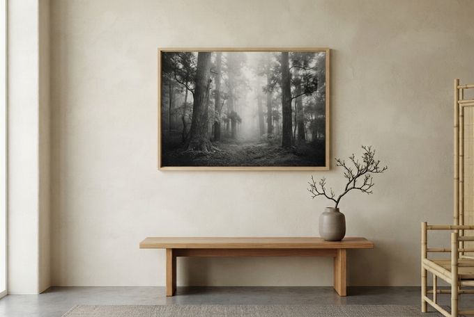 a picture hanging on a wall above a table