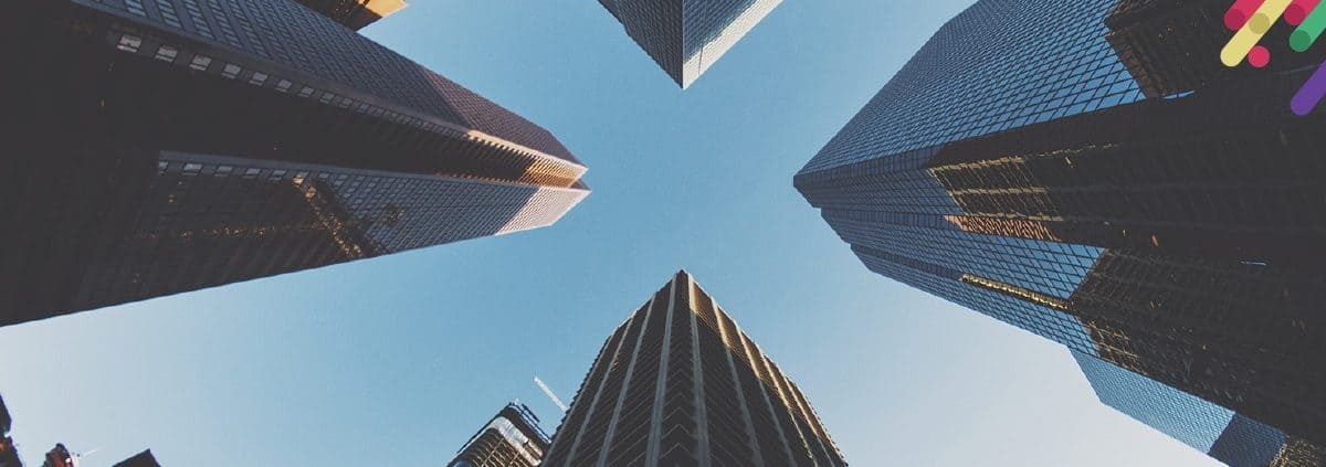 looking up at tall buildings in a city