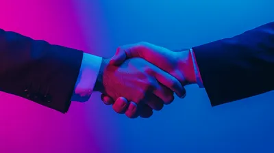 a close up of two people shaking hands