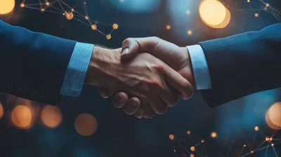 a close up of two people shaking hands