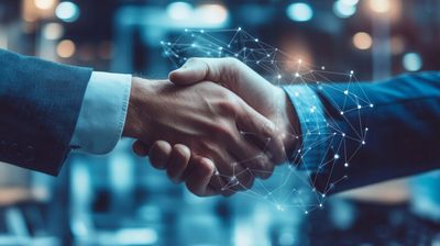 a close up of two people shaking hands