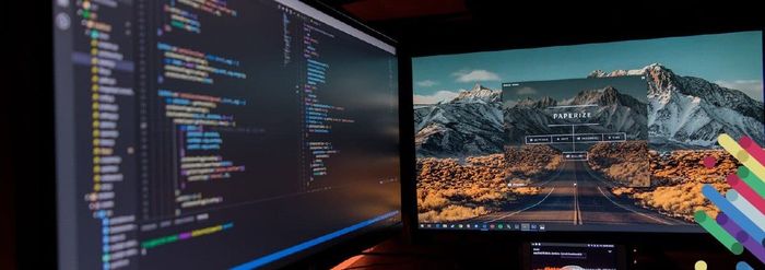 a computer monitor sitting on top of a desk