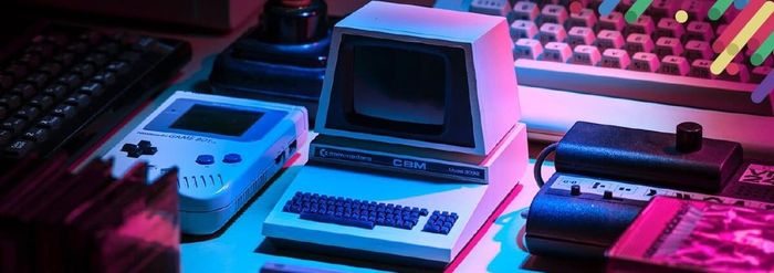 a desk topped with a computer and a keyboard