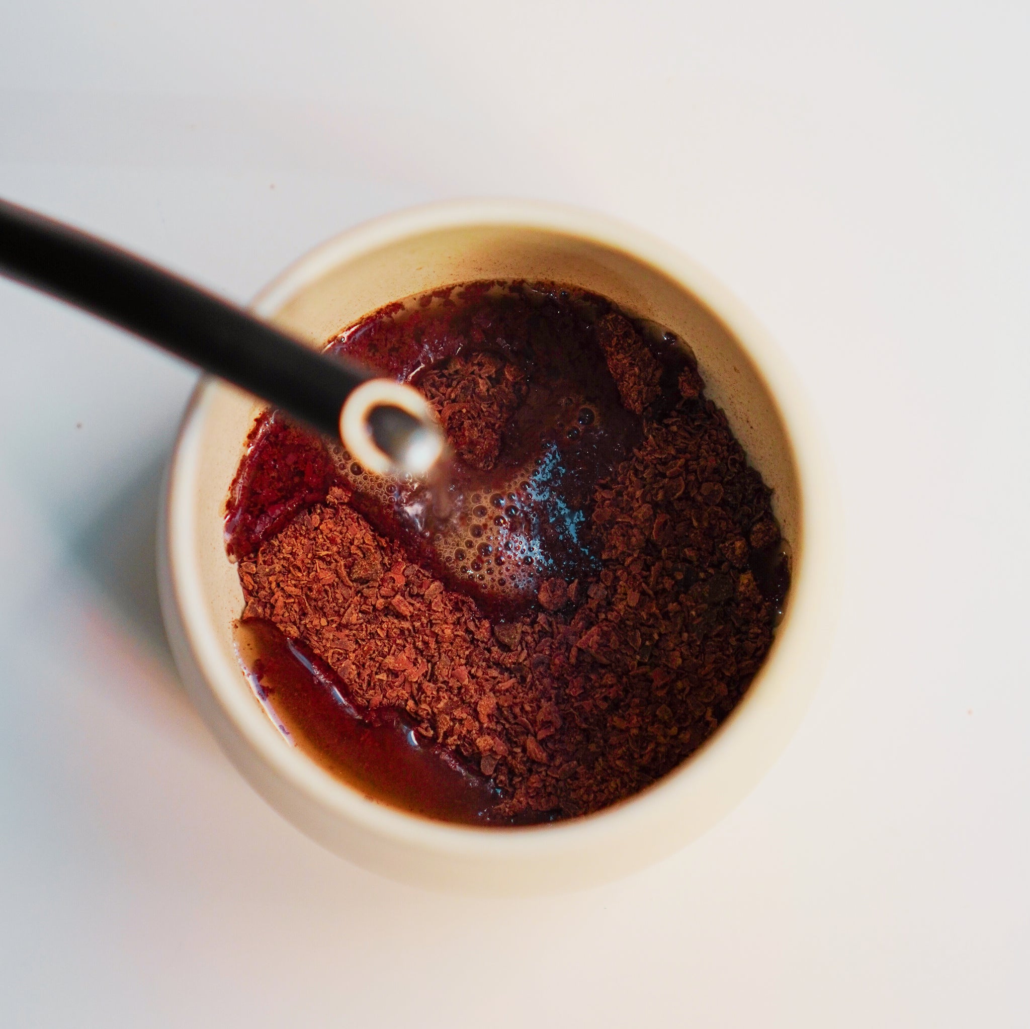 a bowl of Focus Ceremonial Cacao | Kaicao with a spoon in it