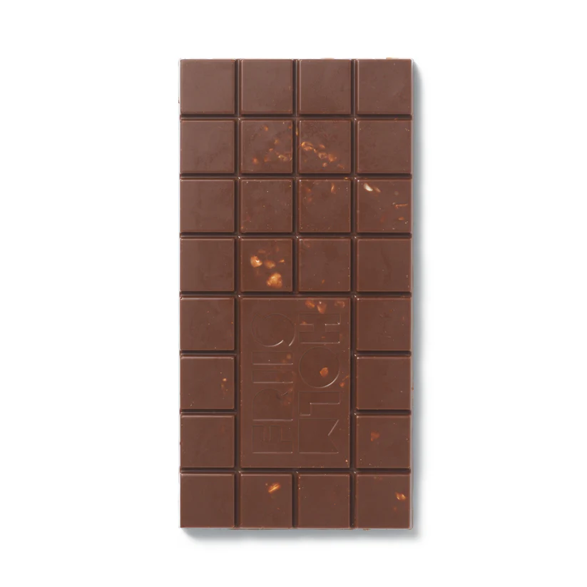 A milk and hazelnut chocolate bar with the word FRIIS-HOLM embossed on it.