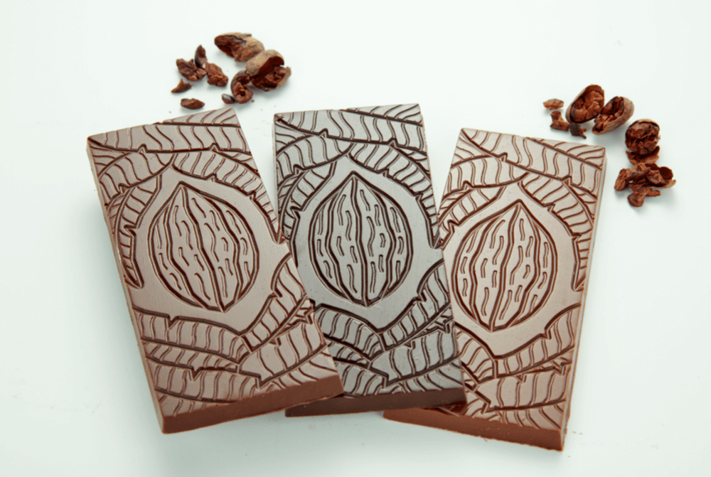 Chocolate slabs embossed with the image of a cacao bean.