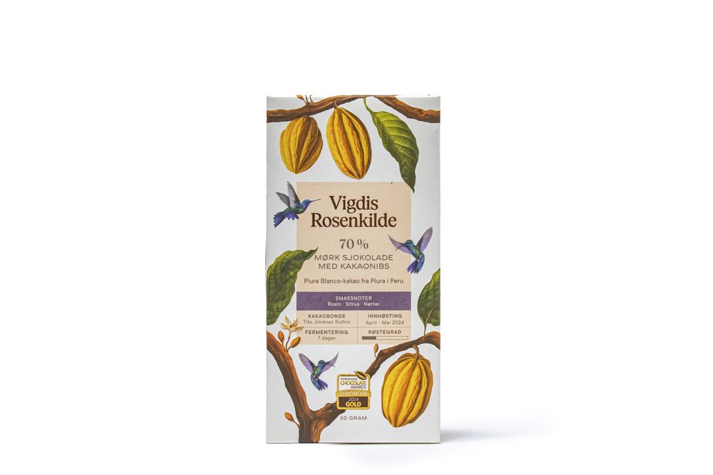 A slab of chocolate with cacao pods, leaves, and hummingbirds on the packaging.