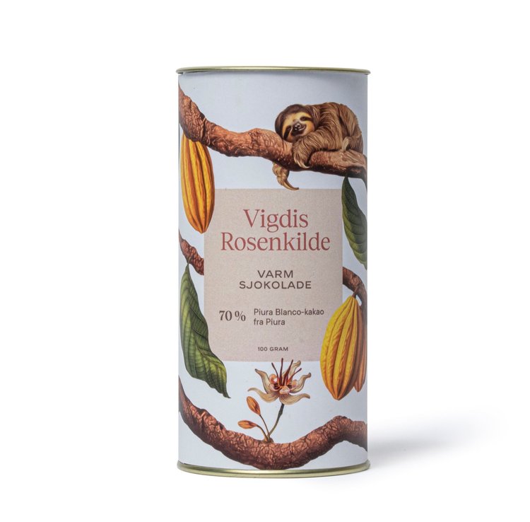 A carton of hot chocolate with cacao pods, leaves, and birds on the packaging.