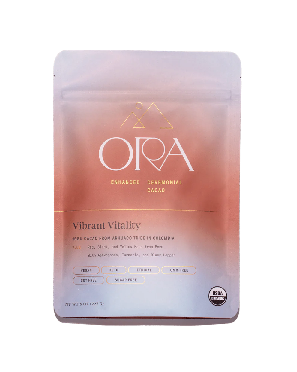 A packet of Ora Vibrant Vitality Ceremonial Cacao. The packing is coral and blue in colour.