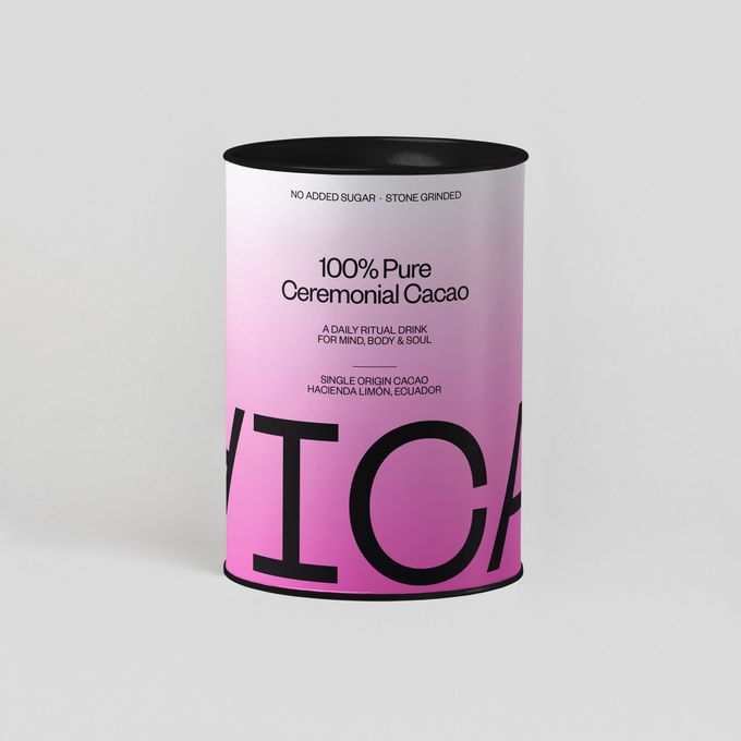 a can of pink and black color on a white background