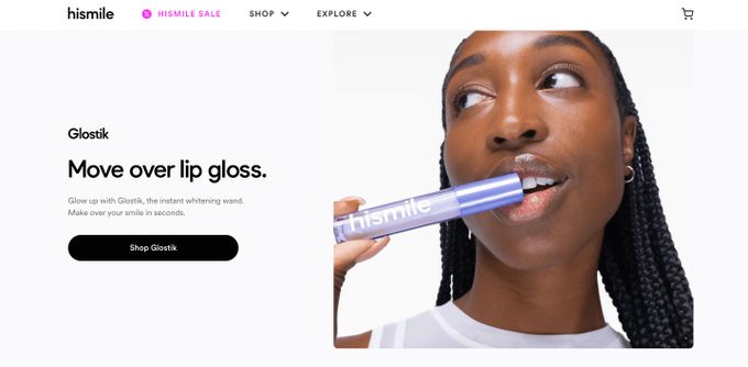 a woman brushing her teeth with a toothbrush