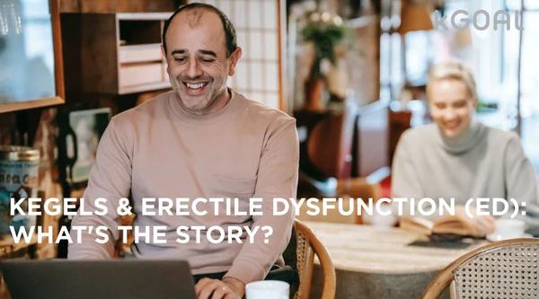 a man sitting at a table with a laptop in front of him