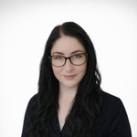 a woman with long black hair wearing glasses