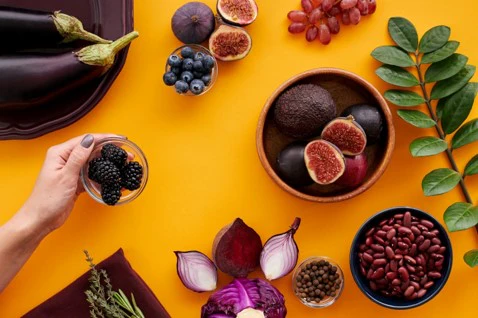 a table topped with bowls of fruit and vegetables