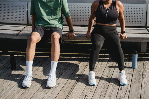 a man and a woman sitting on a bench
