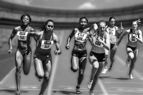 a group of women running on a track