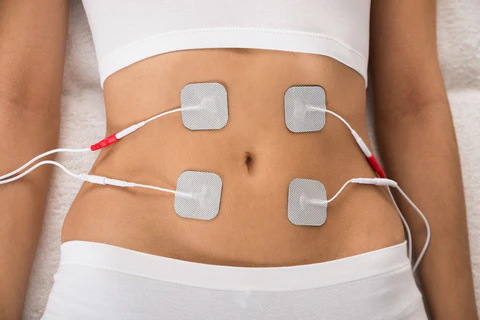 a woman with electrodes attached to her stomach