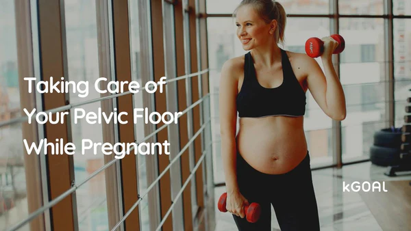 a pregnant woman holding two dumbs in a gym