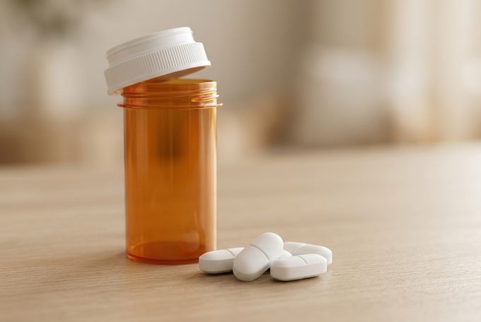 a bottle of pills sitting on top of a table