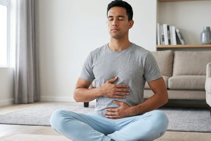 A man practising diaphragmatic breathing.