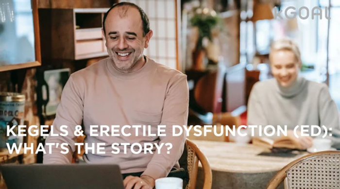 a man sitting at a table with a laptop in front of him