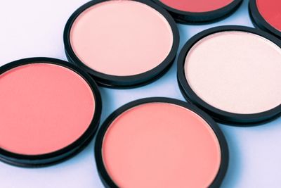 A close-up of a group of blushes that differ in shade.